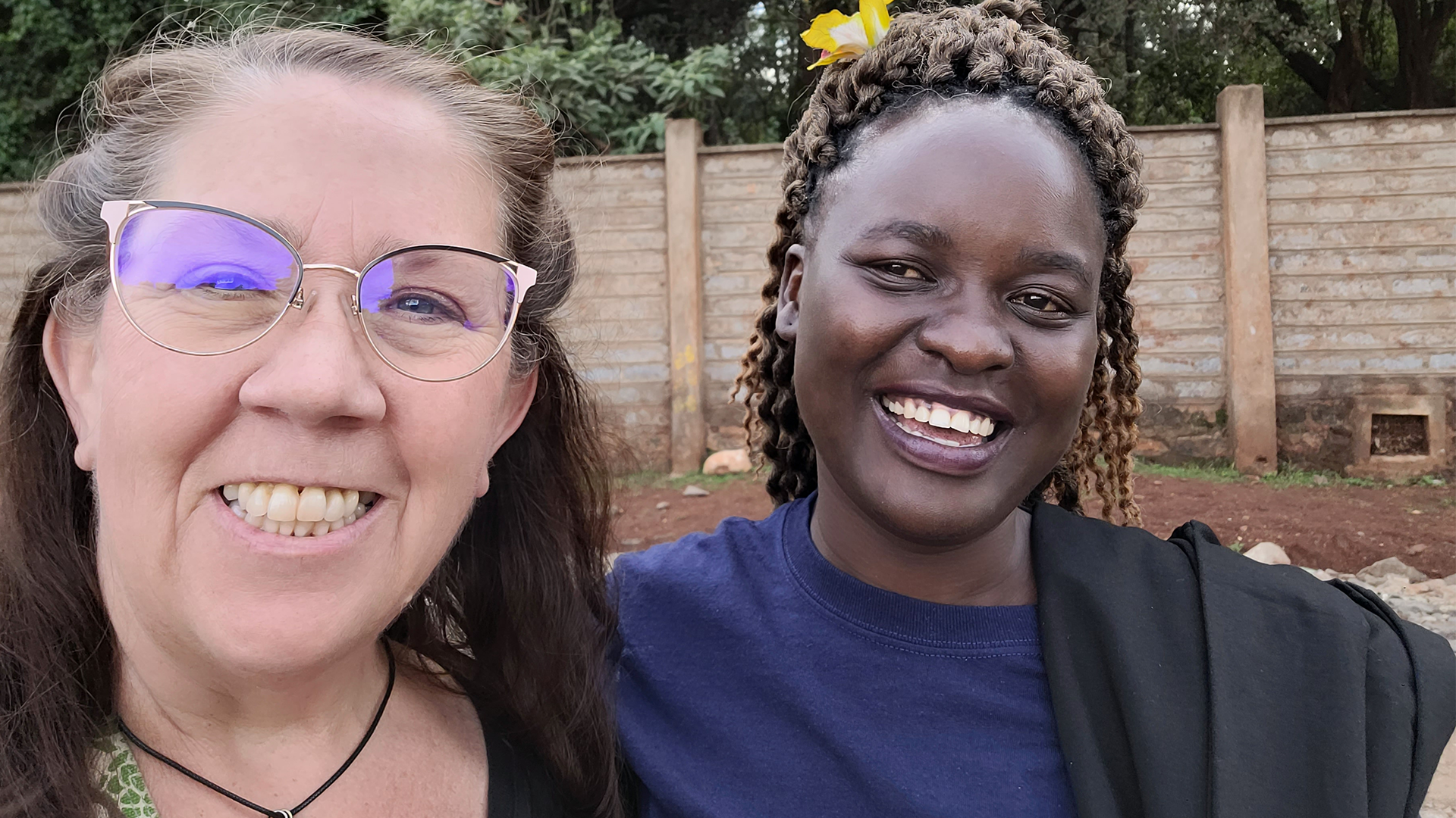 Flutter team member smiling in a selfie with a pregnancy center partner